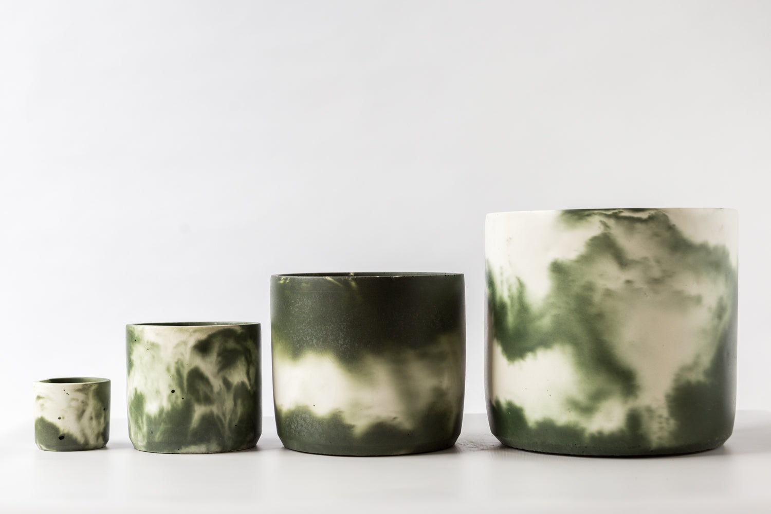 Muddy Green Plant Pots in sizes from small to extra last hand-cast by Concrete Jungle